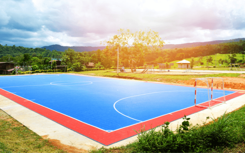 empresa instalacion pavimento campo futbol sala exterior colegio